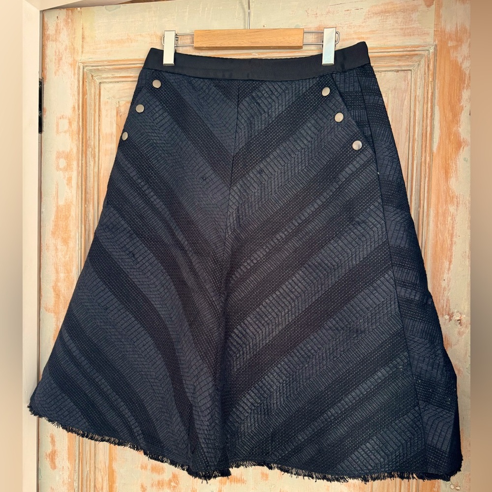 Saba black textured patterned black A-line skirt. US6.